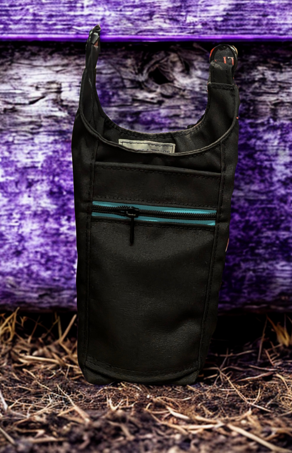 Black and turquoise handmade water bottle carrier with adjustable strap and zip pocket